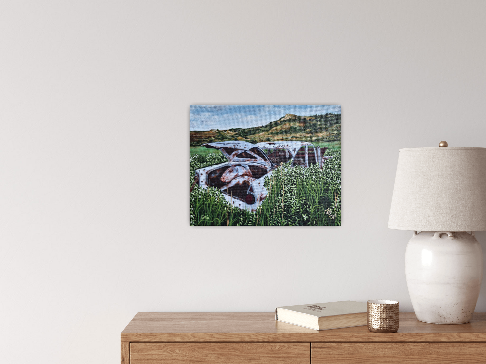 painting of abandoned vintage car with trunk open rusting in the prairie grass