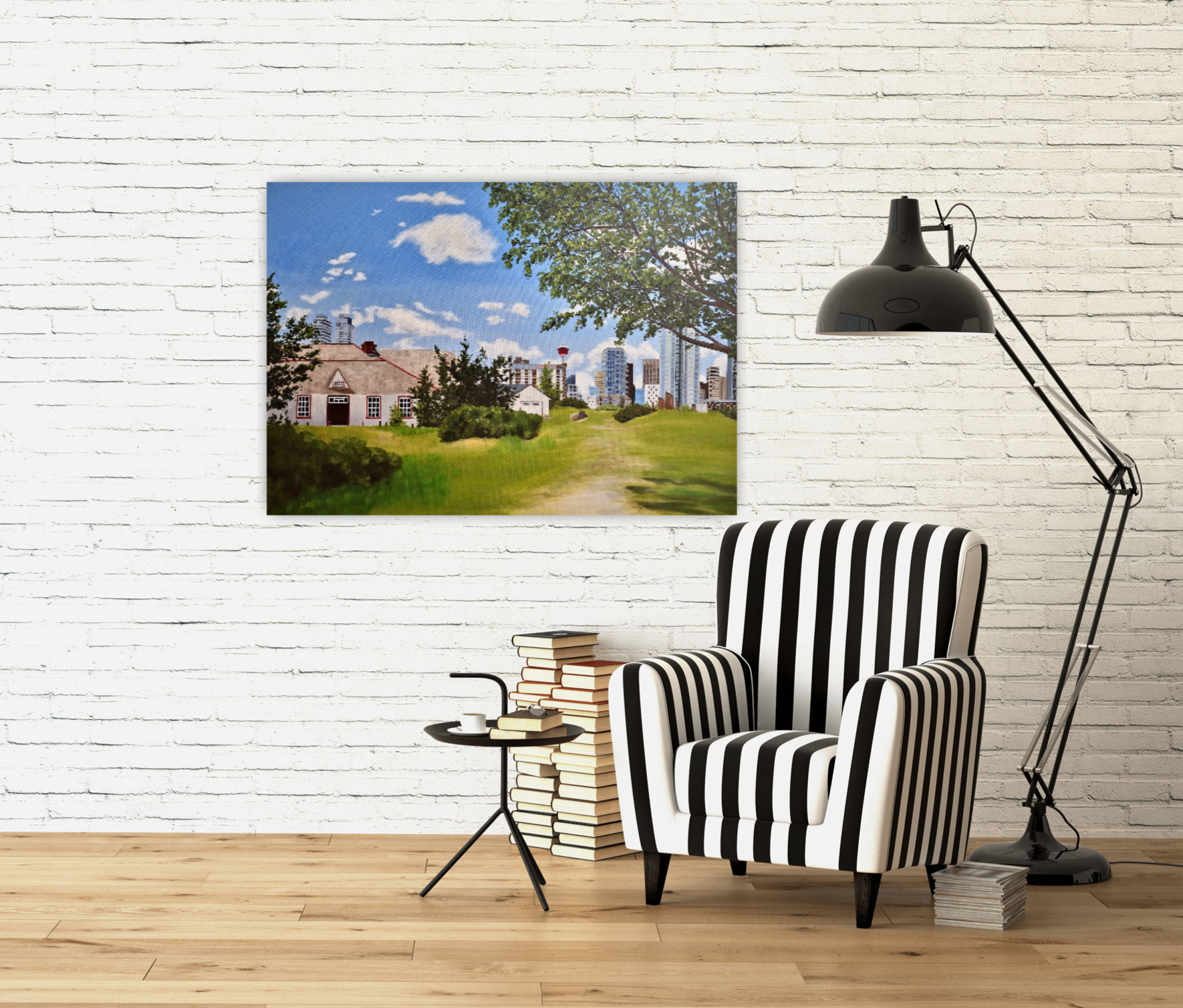 A Path Through Time is an oil painting of the rear of Fort Calgary and the downtown core, on a wall in front of a chair and books