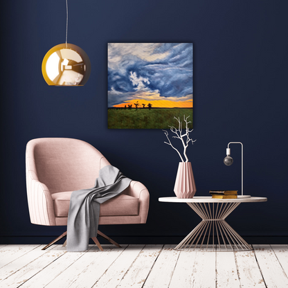 Evening Dichotomy - 16"x16" oil on canvas landscape painting of a prairie field with a few trees and storm clouds at sunset on a blue wall behind a pink chair and table